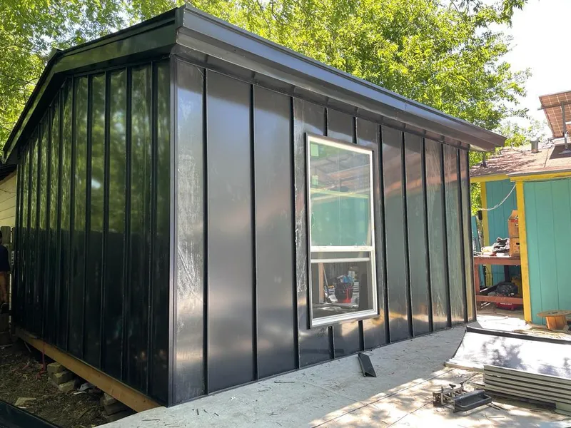 Black standing seam metal wall panels for Metal Roof Installation in Emmett